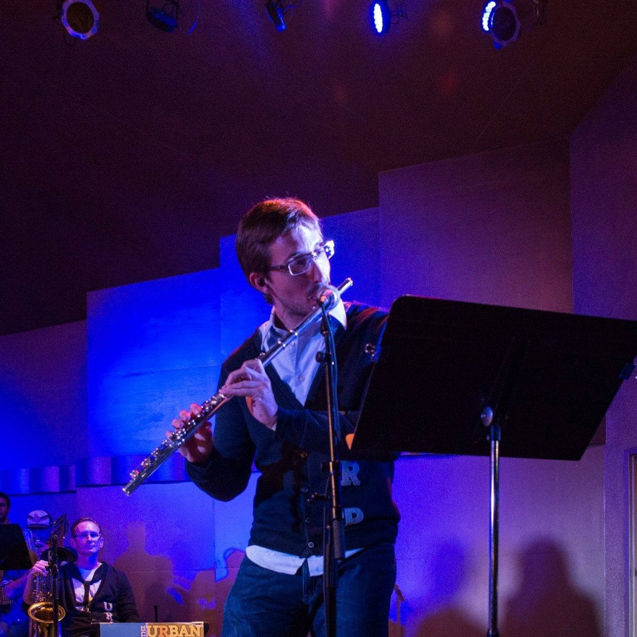 Brian Clements playing flute with the Urban Renewal Project at the Levitt Pavilion